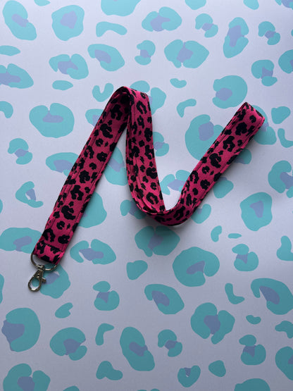 Sew Much Love raspberry pink fabric lanyard with black leopard print and silver D-ring. Handmade for keys and ID badges.