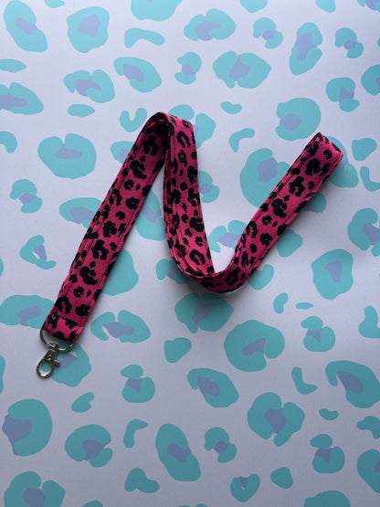 Sew Much Love raspberry pink leopard print fabric lanyard with silver D-ring and swivel clasp.