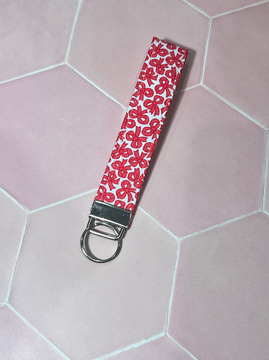 Sew Much Love red and white bow print cotton wristlet keychain with silver hardware.