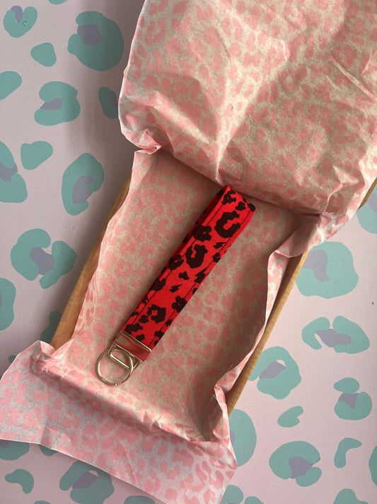 Sew Much Love red leopard print fabric wristlet keychain with silver hardware. Perfect for hands-free convenience.